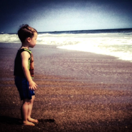 boy looking out at ocean