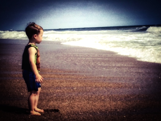boy looking out at ocean